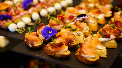 Delicious canapes with smoked salmon. Shallow dof.