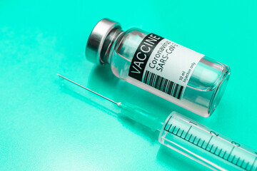 Healthcare cure concept background with coronavirus vaccine vial or glass bottle and medical...