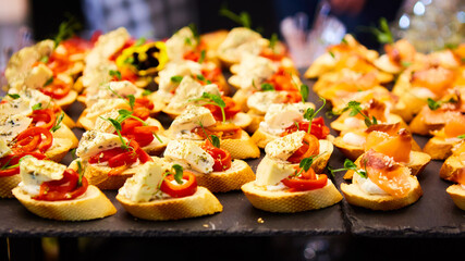 Different snacks and appetizers ready for a cocktail party. Catering concept.