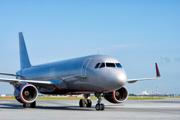 A big jet on its runway getting ready for taking off at airport.