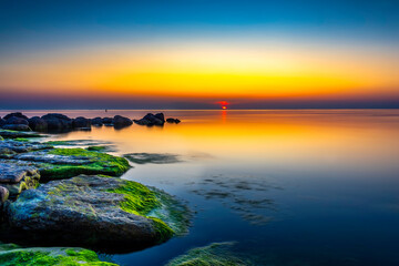 Sunset reflecting into the Baltic Sea during an calm evening