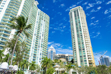 FORT LAUDERDALE, FL - FEBRUARY 29, 2016: City skyscrapers against a blue sky with beautiful clouds