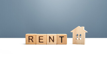 Wooden house and the word Rent. Search for home rental. Realtor services. Renting out of housing...