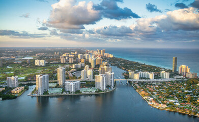 Fototapeta na wymiar Helciopter view of Miami Beach skyscrapers along the shoreline at sunset, Florida