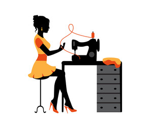 silhouette of a woman sitting and sewing clothes using a sewing machine 