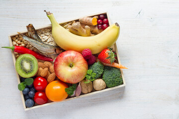 Healthy food on tray on white wooden background, balanced diet concept and healthy lifestyle