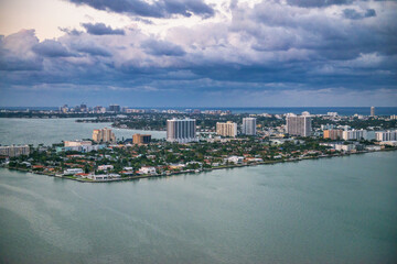 Naklejka na ściany i meble Amazing helicopter aerial view of Miami coastline at winter sunset, Florida