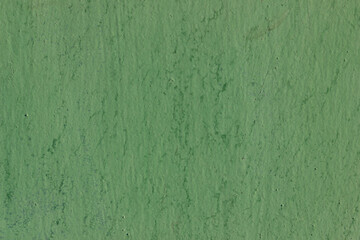 Green paint on old metal wall texture