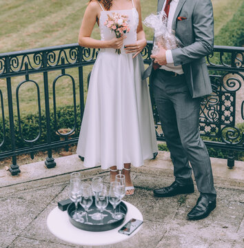 Young Stylish Bridal Couple During The Wedding Ceremony Which Takes Place On The Porch Of The Old Villa.