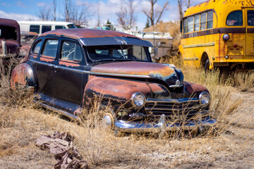 An old retro junked car from a junkyard.