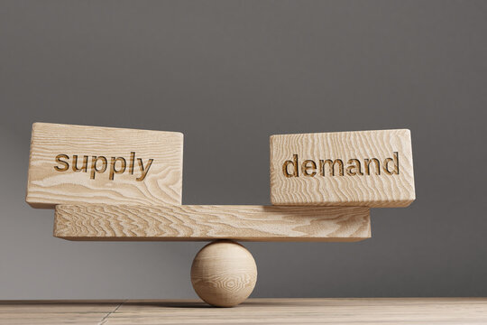 Supply and demand balance concept. Wooden cube block with words Supply and demand on seesaw. Life style concept