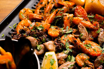 Top view photo of a plate with some seafood.