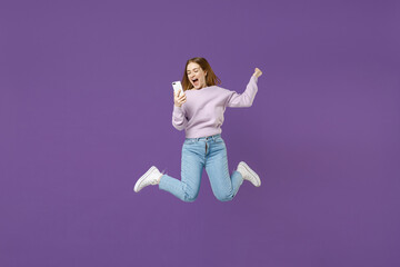 Full length young excited overjoyed student caucasian happy woman 20s wear purple knitted sweater...