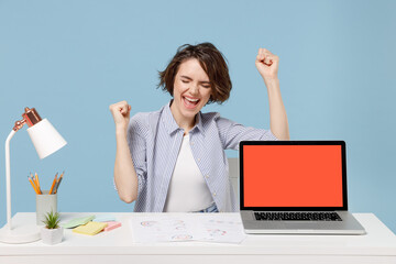 Young successful happy employee business woman in casual shirt sit work at office desk with pc...