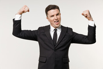 Young strong employee business corporate lawyer man in classic formal black grey suit shirt tie work in office show biceps hand muscles demonstrate strength power isolated on white background studio