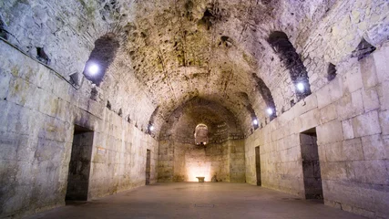 Deurstickers Diocletian's Palace, underground city of Split. Croatia. Bearing walls, columns and arches under the city, remains of the Roman civilization of the historic center of the city. Architectural complex © Naeblys