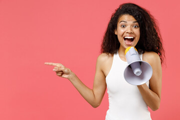 Young fun excited happy african american woman wearing casual white tank shirt scream in megaphone...