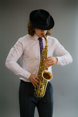 Fototapeta na wymiar Portrait of a man playing the saxophone.