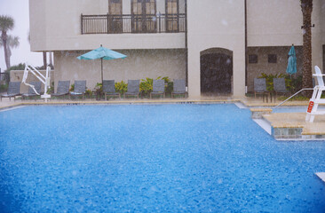 Outdoors swimming pool under the heavy rain