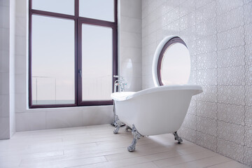 Modern, stylish white bathroom with bathtub . Trendy round and panoramic windows overlooking the...