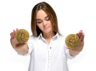 Bitcoin price drop. Coins in the hands of a sad unhappy woman. Mining and cryptocurrency concept. Isolated on white