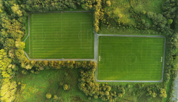 Panorama Image Of Two Football Training Field In A Park. Aerial Drone View. Soccer Pitch View From Top. Nobody