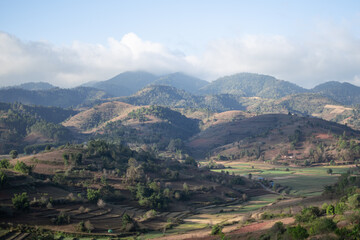 Rolling hills and farm lands with rice fields in Shan state, Myanmar