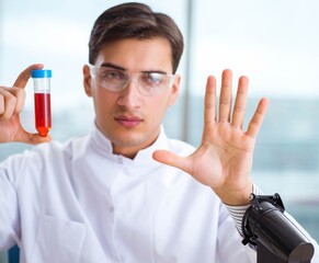 Man doctor checking blood samples in lab