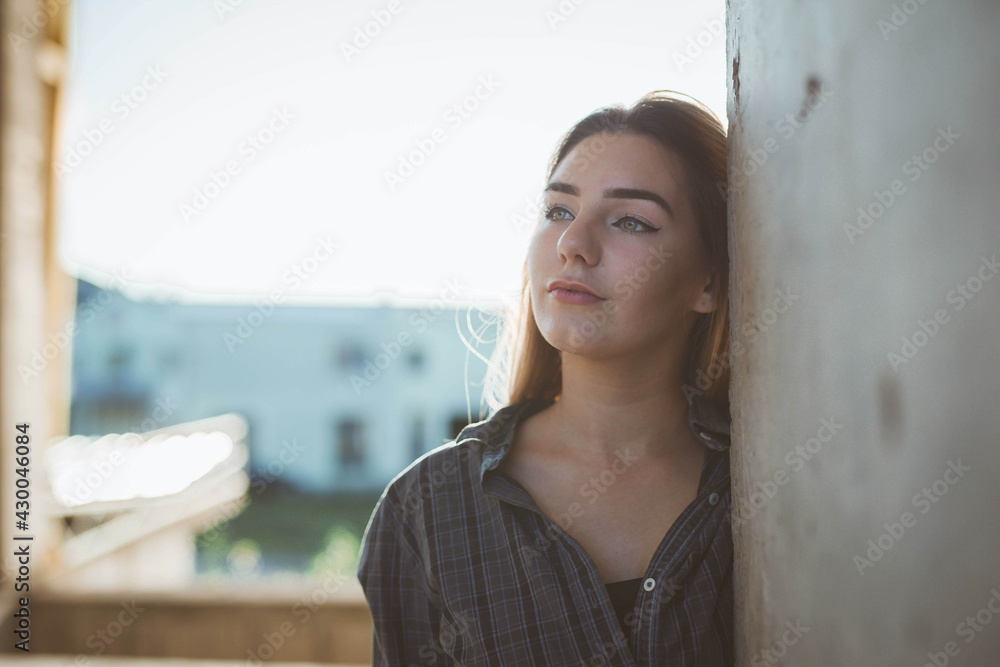 Sticker beautiful blonde caucasian woman wearing flannel leaning on wall