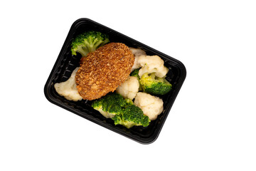 Lunch box with broccoli, cauliflower and cutlet. Food delivery. Top view. Isolated.