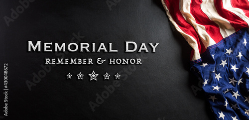 Happy memorial day concept made from american flag with text on black wooden background.