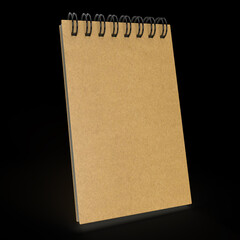 Kraft wire-bound notebook on black background