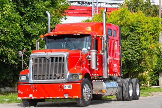 Panama David April 22, red semi tractor-trailer truck with chrome vertical mufflers. Shoot on April 22, 2021