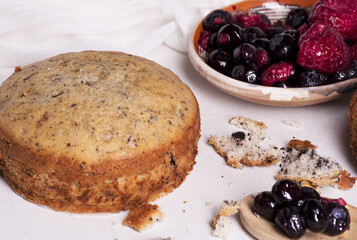 tasty homemade cake and berries on plate, white background. Homemade food concept