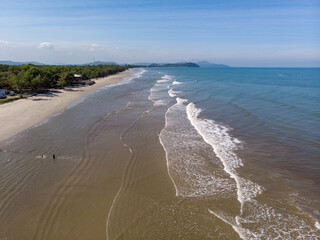 Aerial drone image view of ocean waves crashing on beach