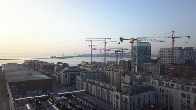 Aerial Drone, Skyline Reveal of Harbour City with Cranes and Windmills, Copenhagen, Denmark