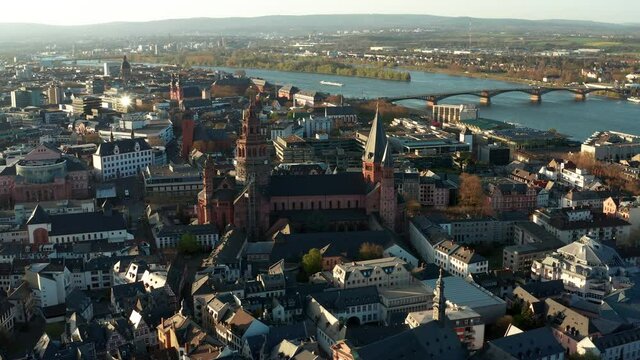 Mainz aerial drone shots around the Cathedral church on a warm spring day showing the blue river in the back