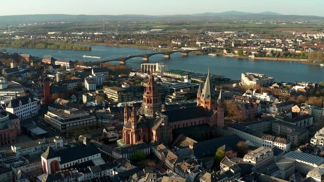 Getting closer to the Cathedral church of Mainz on a warm spring day showing the blue river in the back