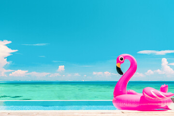 Travel Vacation Pool Beach travel concept with inflatable pink flamingo float toy mattress in luxury swimming pool. Luxury lifestyle summer holidays travel background - obrazy, fototapety, plakaty