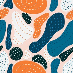 Abstract pattern of tropical leaves with broken lines and dots. Beautiful color combination of orange and blue. Suitable for clothing design