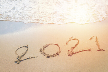 Happy New Year 2021 is coming concept sandy tropical ocean beach lettering