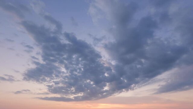 cloudscape timelapse, sunrise or sunset colorful purpul and orange sky and gray clouds, Beautiful sunset with purple and red sky, twilight time in the sky. nature background romantic scenery..