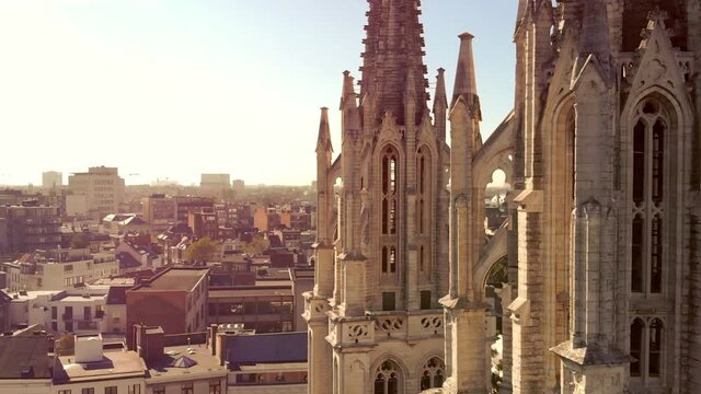 Fly-through Antwerp Saint George's church Towers Revealing cityscape, Belgium - Aerial rotation ascending shot