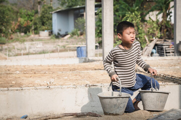 Children working at construction site for world day against child labor concept, Poverty, Human...