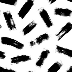 Brush strokes vector seamless pattern. Black paint freehand scribbles, straight lines, dry brushstroke texture. Chaotic rough smears. Black and white mosaic texture. Hand drawn grunge ink illustration