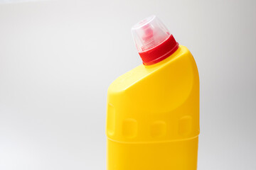 Yellow plastic container with red cap