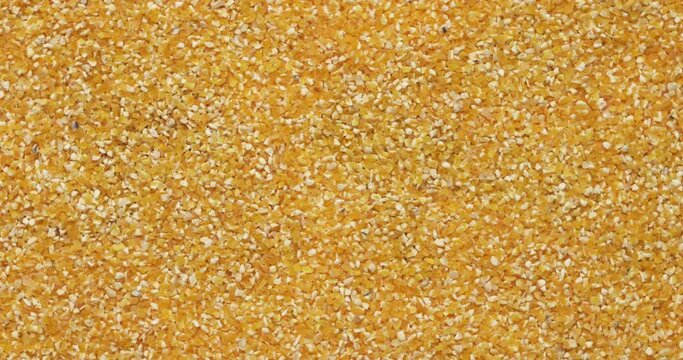 Closeup corn groats rotation, background, texture. Slow motion. Food background.