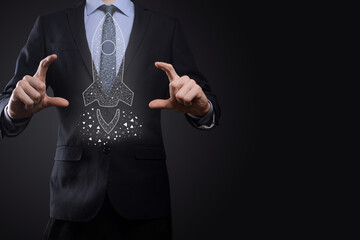 Startup business concept, Businessman holding icon transparent rocket is launching and soar flying out from screen with network connection on dark background.