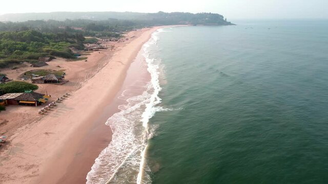 goa Sinquerim Beach drone bird's eye view drone coming down towards the beach