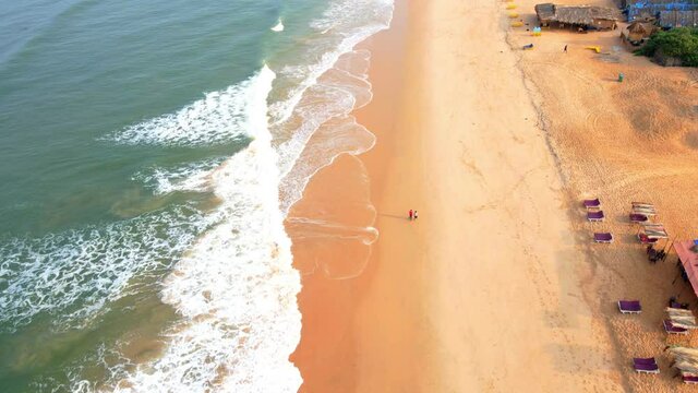 goa Sinquerim Beach drone bird's eye view drone coming down towards  tilt-up camera reviling shot